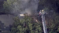 Fast-moving Roswell fire sends officer to hospital, displaces 30