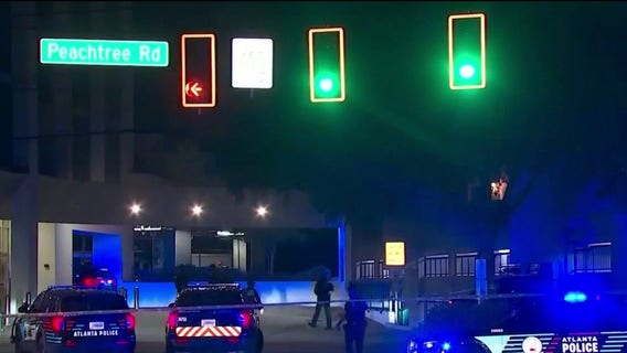 Man killed at Buckhead apartment parking deck, 3 detained