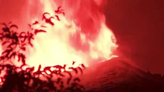 Flames shoot from roof of west Atlanta home early Friday morning