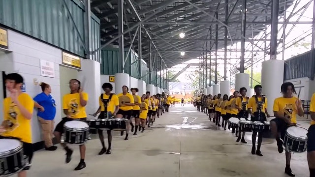 Watch: Band director stops halftime performance to deliver life-changing news