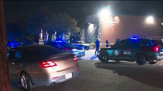 Man killed outside Atlanta business; suspect held in Lawrenceville