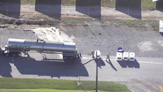 Contractor cleaning up aluminum chloride leak in Cedartown