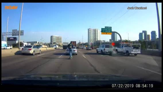 Dash camera captures Lime scooter rider on I-35 in downtown Dallas during rush hour