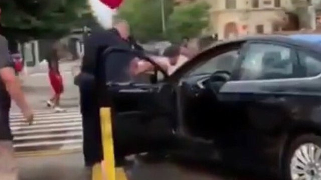 NYPD slams videos showing officers pelted with objects, drenched with water: 'reprehensible'