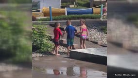 Heartwarming moment two friends help tired little boy with cerebral palsy walk at water park