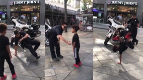 Boy, officer bust out insane moves in break dance face off