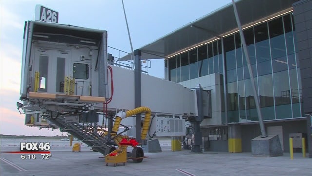 Airline employee killed after luggage vehicle flips, pins worker