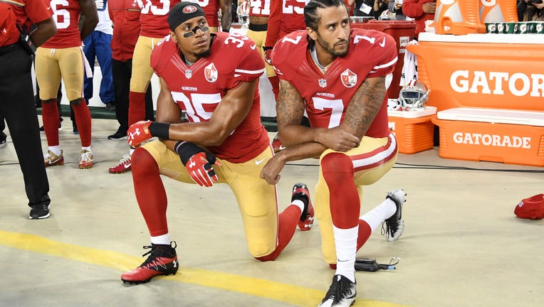 SANTA CLARA, CA - SEPTEMBER 12: Colin Kaepernick #7 and Eric Reid #35 of the San Francisco 49ers kneel in protest during the national anthem prior to playing the Los Angeles Rams in their NFL game at Levi's Stadium on September 12, 2016 in Santa Clara, California. (Photo by Thearon W. Henderson/Getty Images)