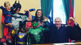 Family wears superhero costumes to ‘fearless and brave’ 4-year-old’s adoption