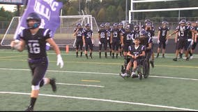 High school student with rare disorder takes football field for the first time at Potomac Falls as honorary captain