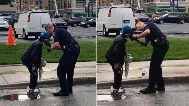 Detroit officer helps man shave outside Comerica Park