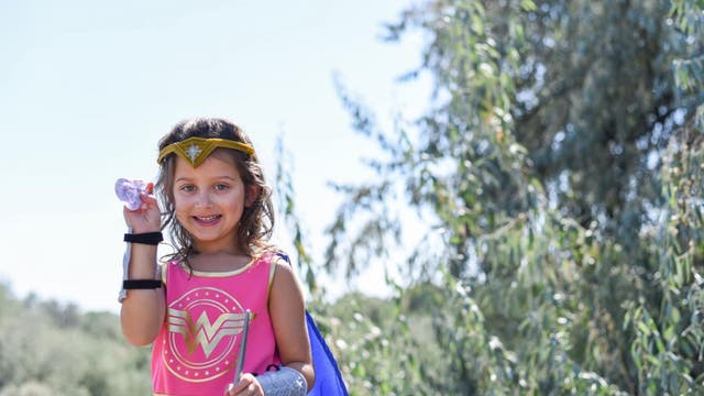 Girl celebrates recovery with ‘Wonder Woman’ photo shoot after nearly losing sight in one eye