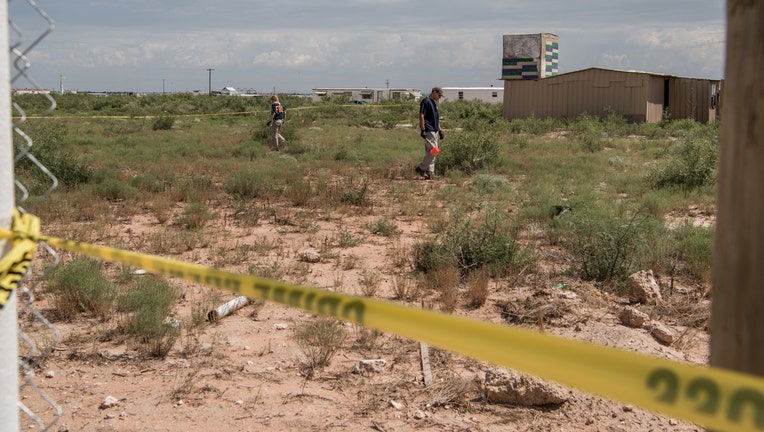 WEST ODESSA, TX - SEPTEMBER 1: FBI agents search a home believed to be linked to a suspect following a deadly shooting spree on September 1, 2019 in West Odessa, Texas. Seven people had been killed, in addition to the gunman and at least 21 others were wounded, including three law enforcement officers after a gunman went on a rampage. The man who has not been identified fled from state troopers who had tried to pull him over. The gunman then hijacked a United States postal van and indiscriminately fired from a rifle at people before the authorities shot and killed him outside a movie theater in Odessa. (Photo by Cengiz Yar/Getty Images)