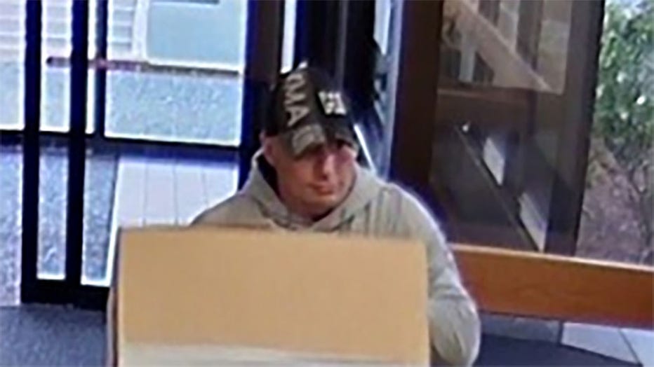 The suspect was pictured in surveillance footage at Providence Milwaukie Hospital, police said. The ATM was reported to have $17,000 in it when the machine was stolen. (Photo credit: Milwaukie Police Department)