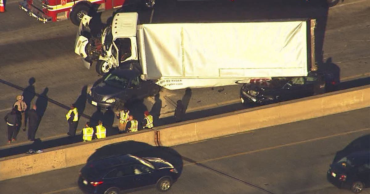 2 hurt when truck overturns onto cars on beltway | FOX 5 DC