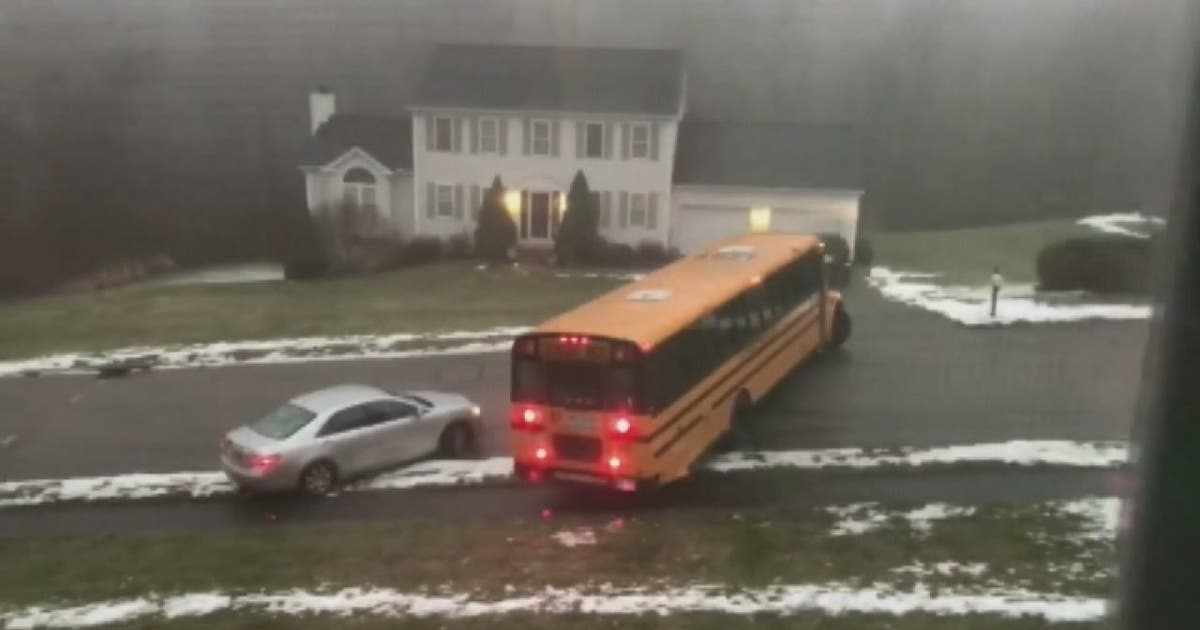 School bus filled with students slides down icy street, crashes into ...