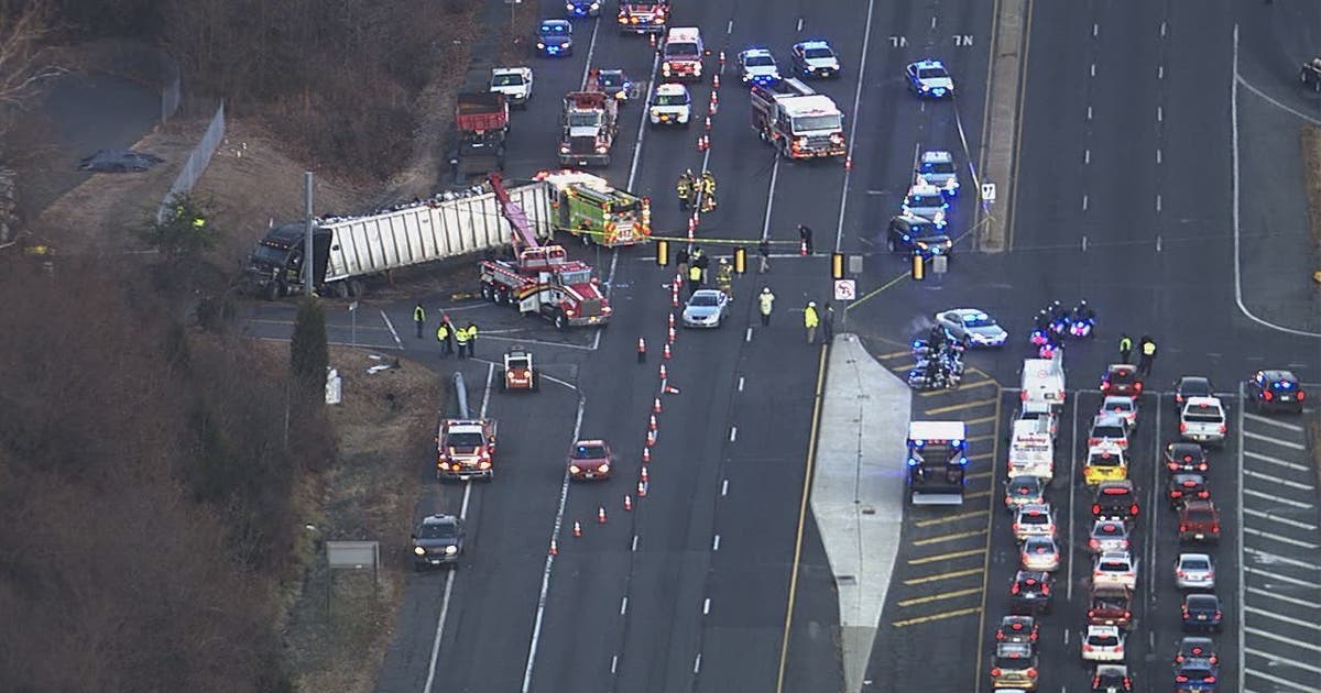 Overturned tractor trailer crash causes delays, downs power lines in ...