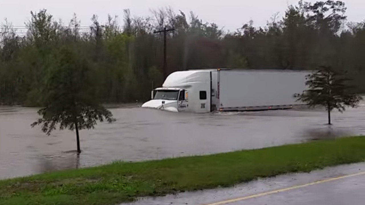 VIDEO Tractortrailer drives through dangerous flood waters in South