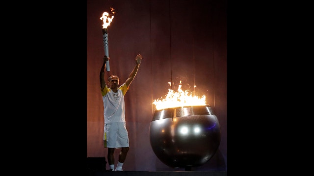 Rio delivers a simple, but spirited, Olympic welcome