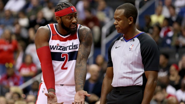 Last-second putback by Heat dooms Wizards in season opener