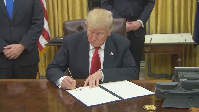 On first day, Trump signs executive order aimed at Obamacare