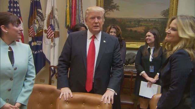 As opposition outcry grows, Trump defends immigration order
