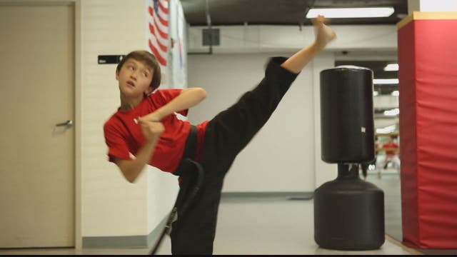 9-year-old Taekwondo Black Belt instructor imparts wisdom to kids and adults, including his own mom