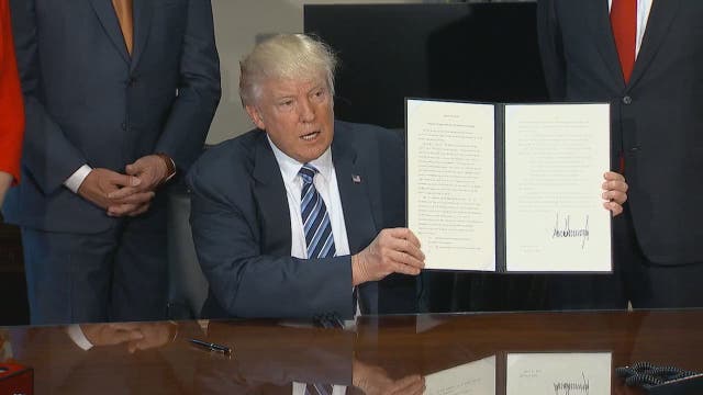 Trump eyes changes to Obama's tax and Wall Street rules