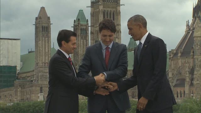 President Obama shares awkward handshake with leaders from Mexico, Canada