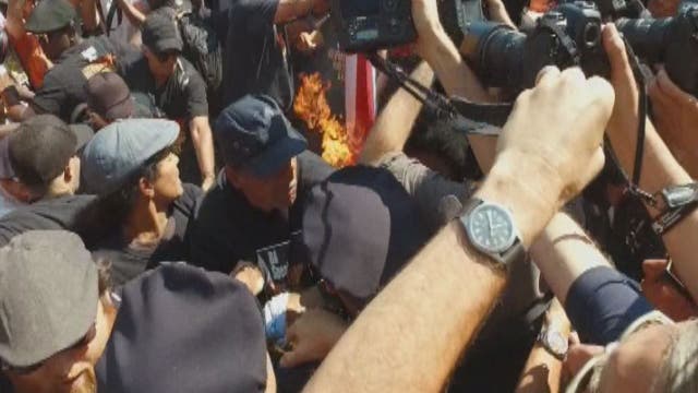 17 arrested in flag-burning melee outside GOP convention
