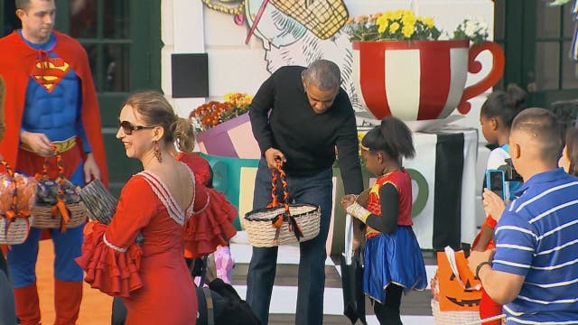 Obamas hand out treats at the White House for Halloween