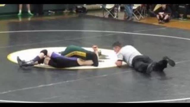 Undefeated wrestling team captain lets student with Down syndrome pin him