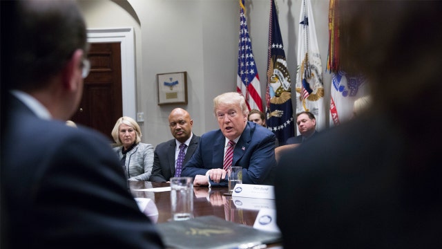 Trump says raise age for buying assault rifles, defying NRA