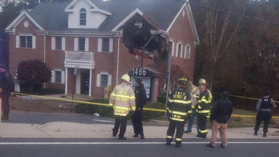 2 dead after Porsche crashes into 2nd floor of building