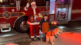 Santa makes surprise visits to two young boys who were denied meeting him over their service dogs