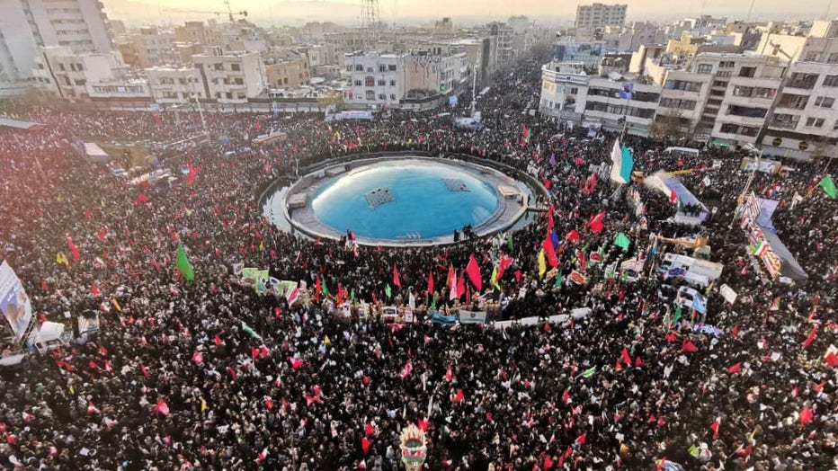 Mourners gather to pay homage to top Iranian military commander Qasem Soleimani, after he was killed in a U.S. strike in Baghdad, in the capital Tehran on Jan. 6, 2020. (Photo by ATTA KENARE/AFP via Getty Images)