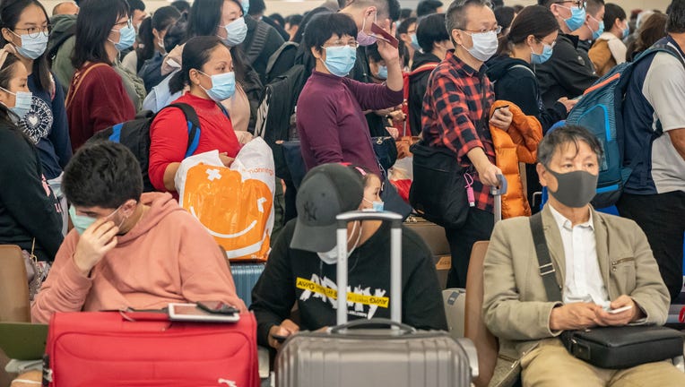 7c0b0c23-4a7a8c7b-Deadly Wuhan Coronavirus Spreads To Hong Kong