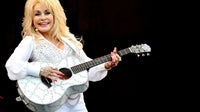 Dolly Parton honored by President Trump as flags are ordered to half staff