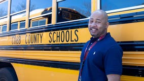 Cobb County school bus driver rescues woman trapped in car