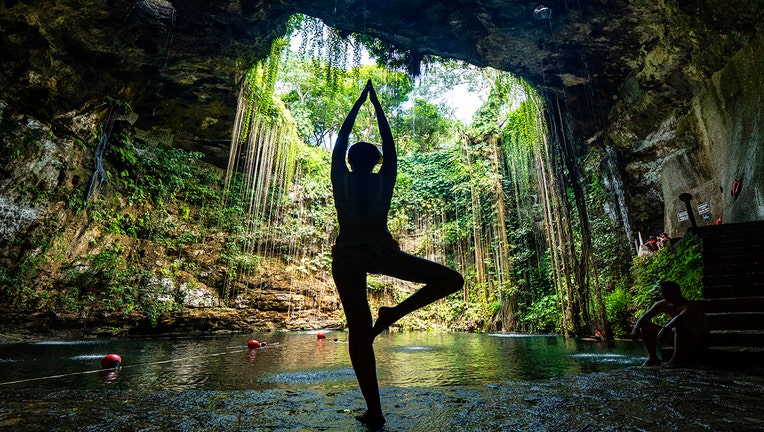 Tourist does yoga in Mexico-400801
