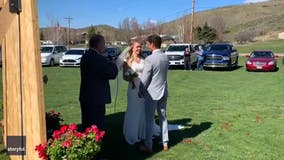 Friends and family celebrate couple’s wedding from their cars in drive-thru ceremony amid pandemic