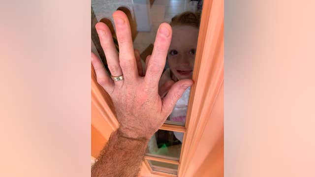 Viral photo shows nurse separated from family due to coronavirus concerns