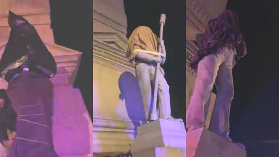 Protesters cover Portsmouth Confederate statues in sheets, trash bags