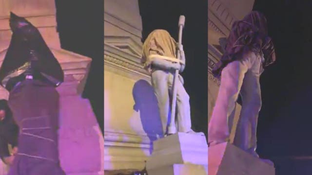 Protesters cover Portsmouth Confederate statues in sheets, trash bags