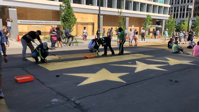 DC won't remove "Defund The Police" street art next to Black Lives Matter mural