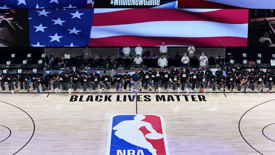 Players, coaches kneel before NBA's re-opening night