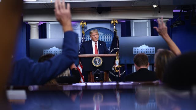 Trump abruptly escorted out of White House press briefing, returns to say there was a 'shooting' outside