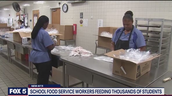 School foodservice workers feeding thousands of students