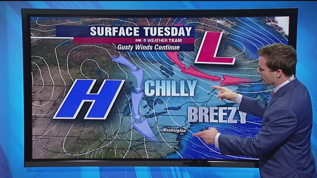 Chilly, breezy Tuesday with a possible passing shower and highs in the low-50s