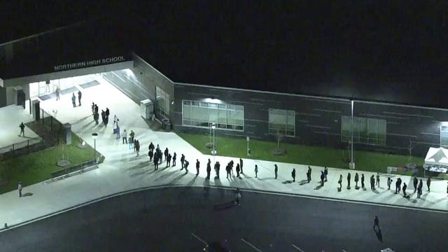 Voters wait in hours-long lines to cast their ballots in Calvert County